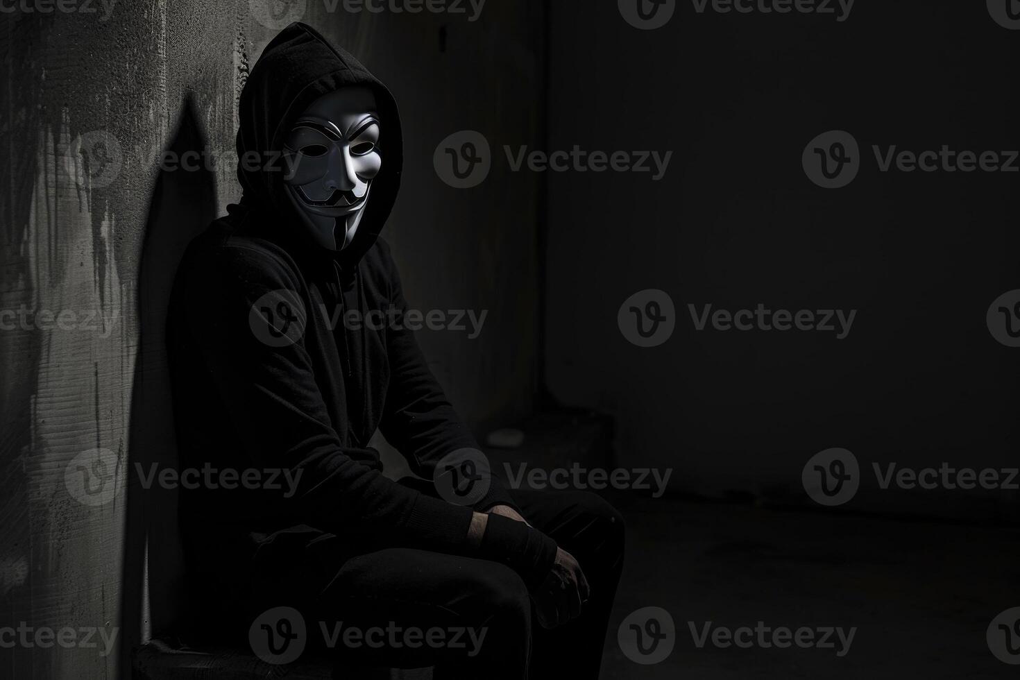 A man wearing a mask sits on a wall photo