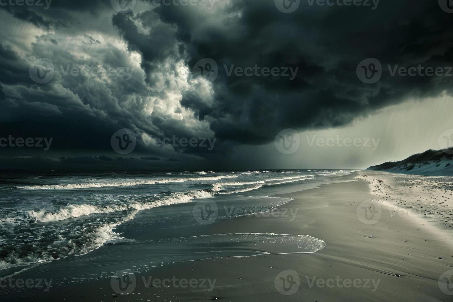 Stormy sky over the ocean with waves and sand photo