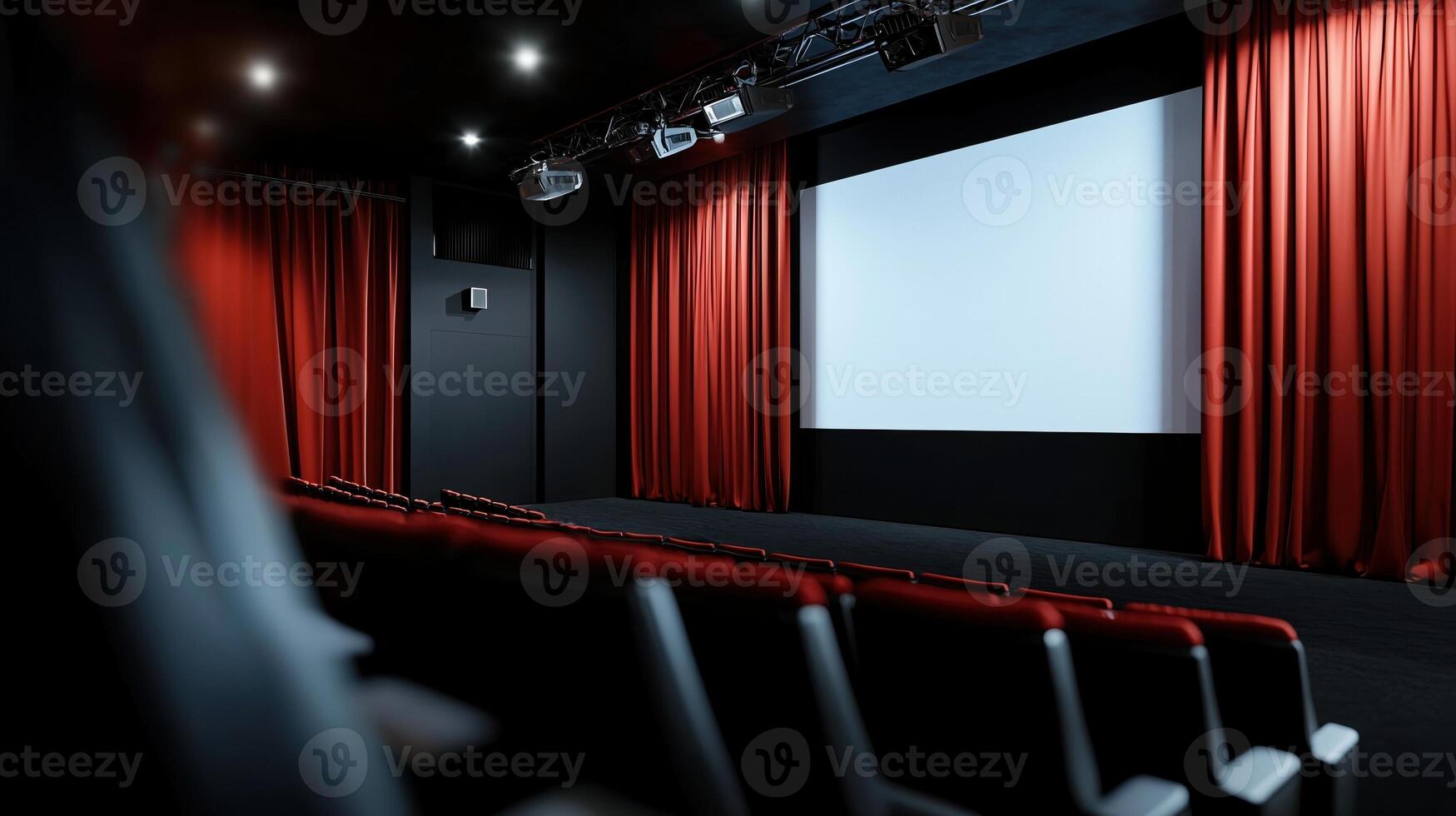 An empty theater with red curtains and a screen photo