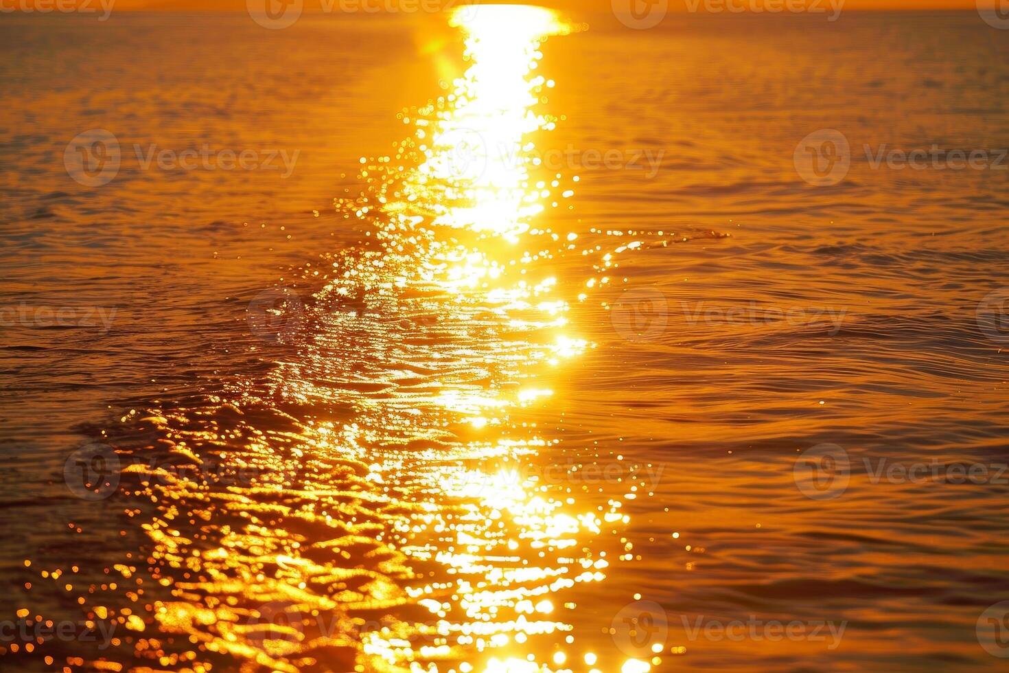 A boat is in the water at sunset photo