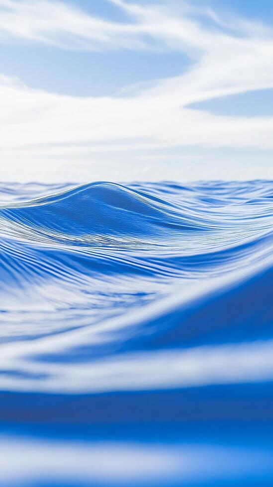 A blue ocean with waves and clouds photo