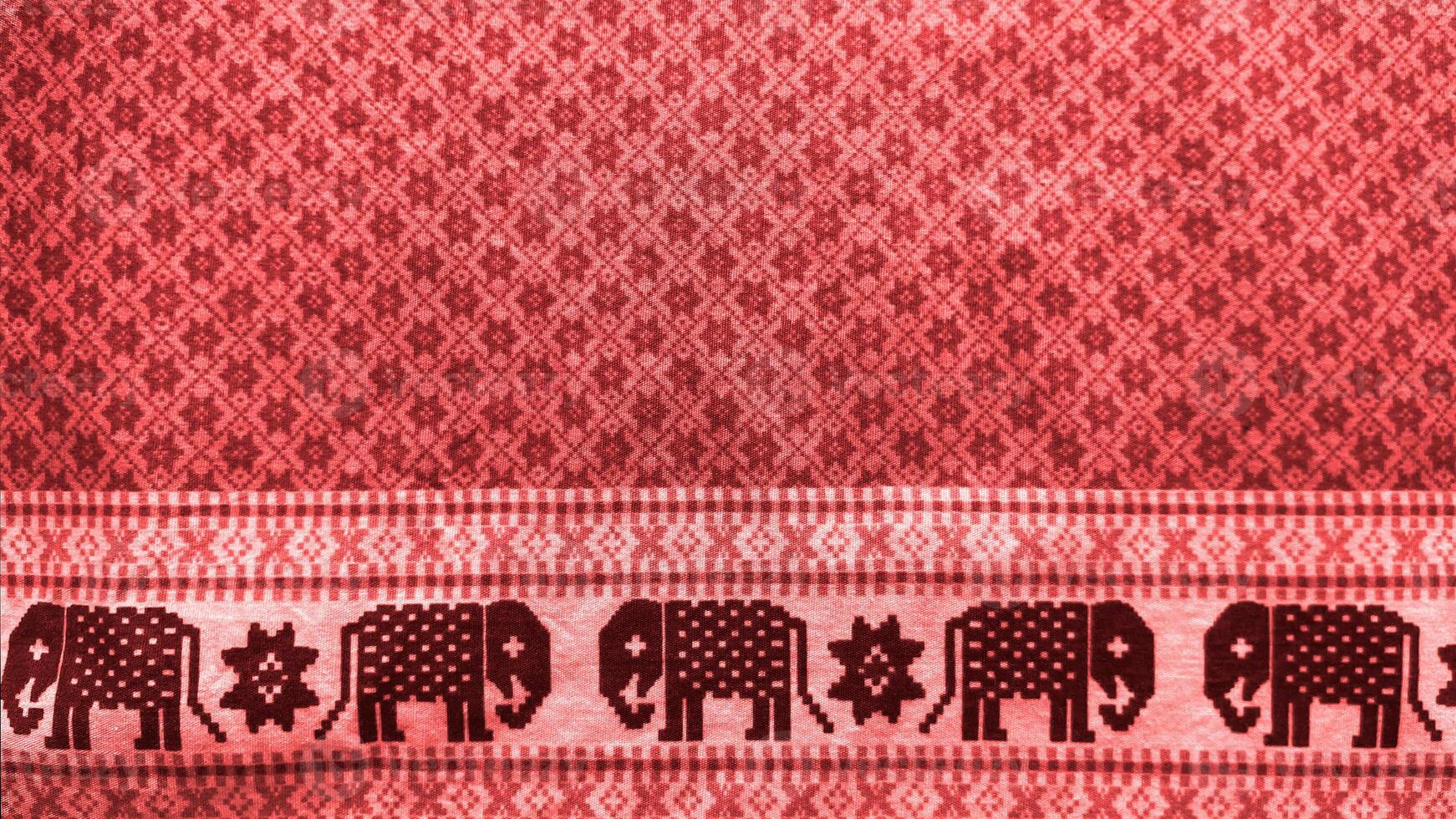 A red background with elephants on it photo