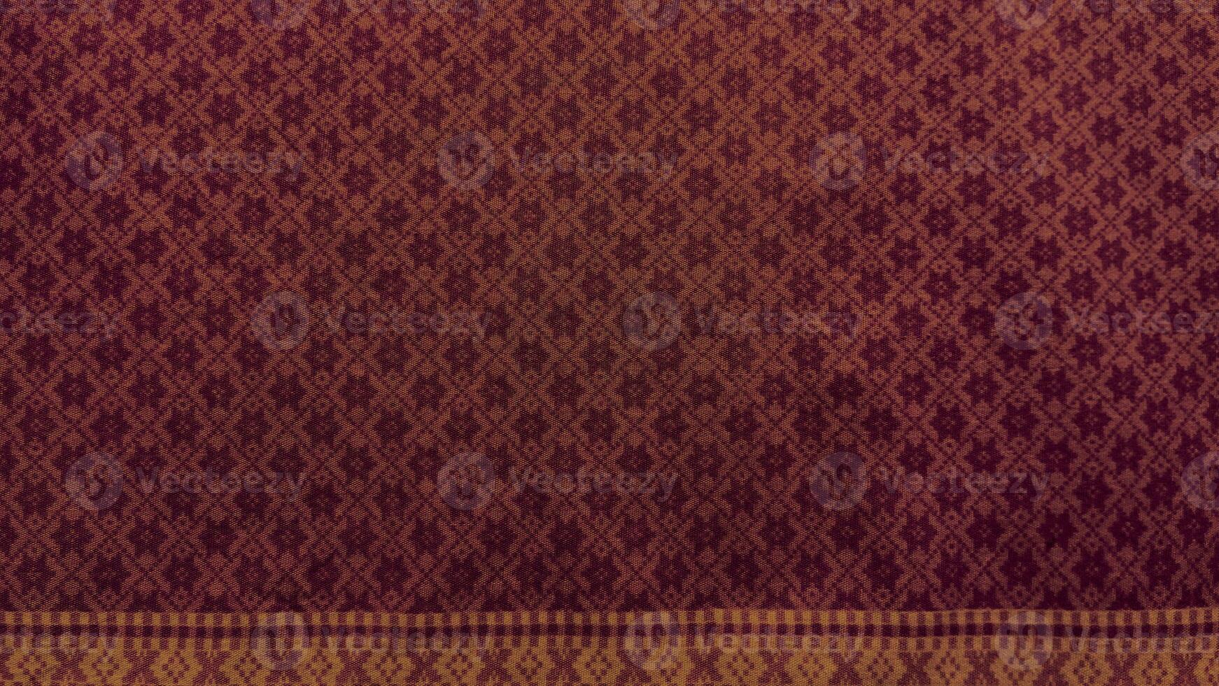 A piece of cloth with a pattern of squares and circles.16 photo