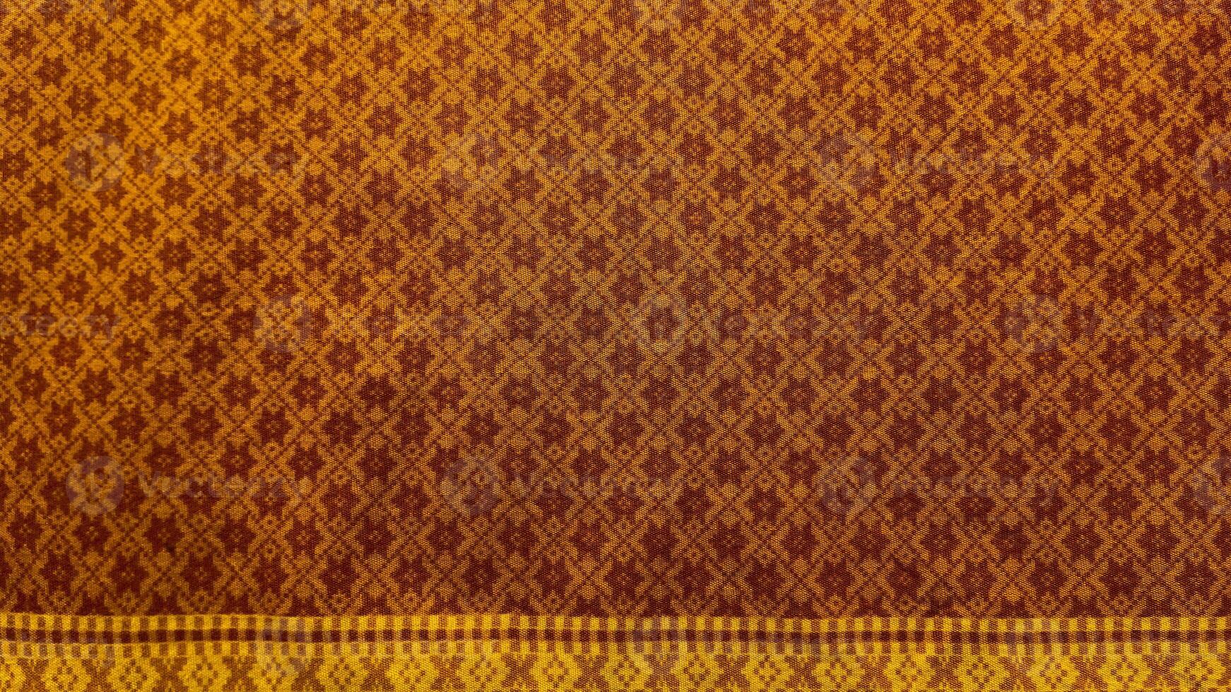 A piece of cloth with a pattern of squares and circles.39 photo