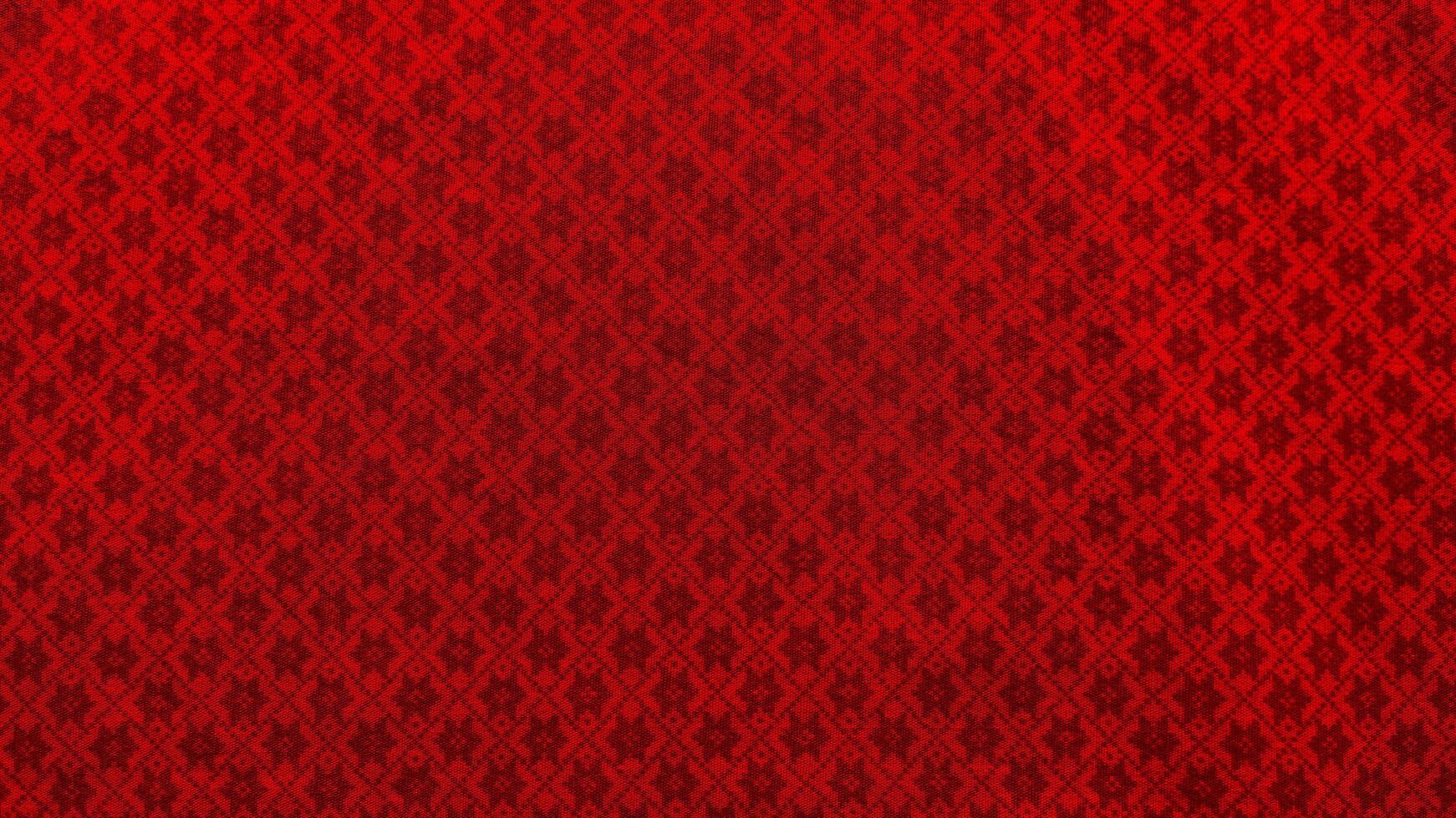 A red fabric with a pattern of squares photo