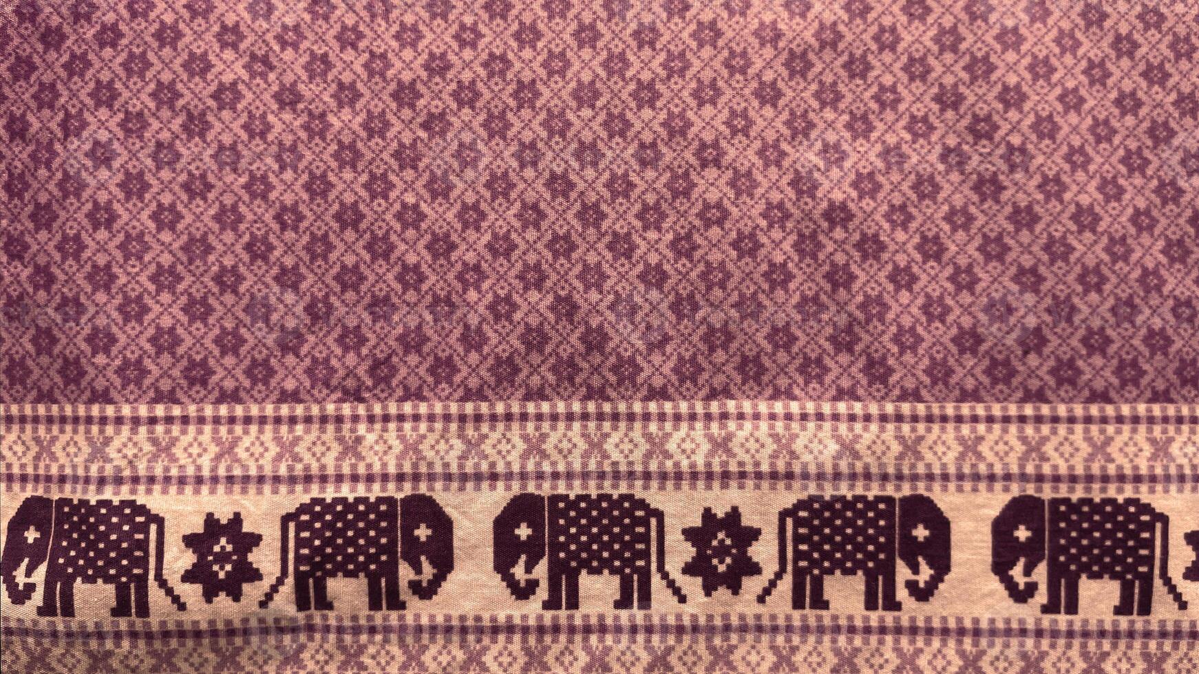 A purple fabric with elephants on it.37 photo