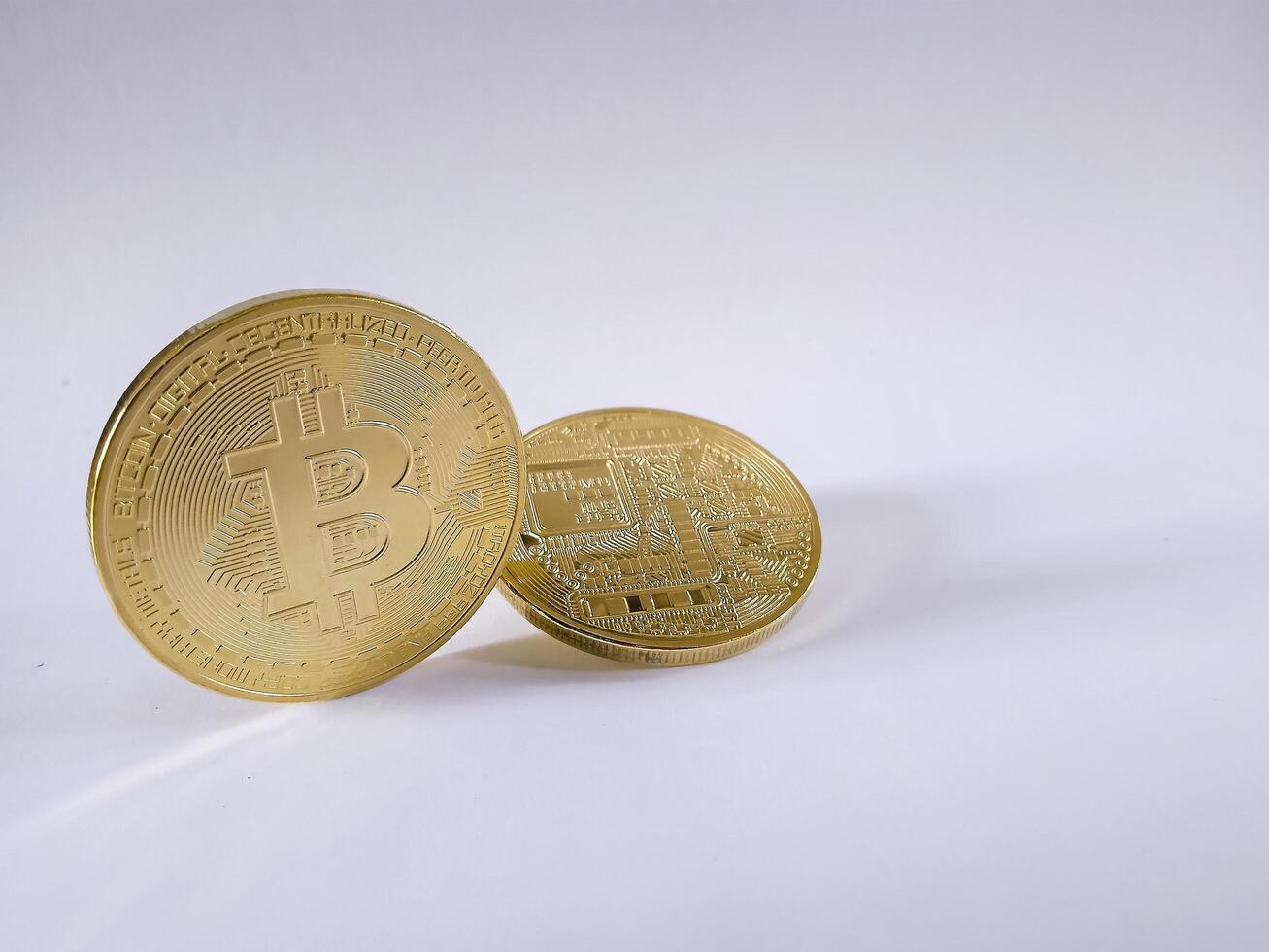 bitcoin cryptocurrency is coin crypto with btc symbol. bitcoin is modern electronic money. bitcoin on isolated white background. bitcoin material from metal photo