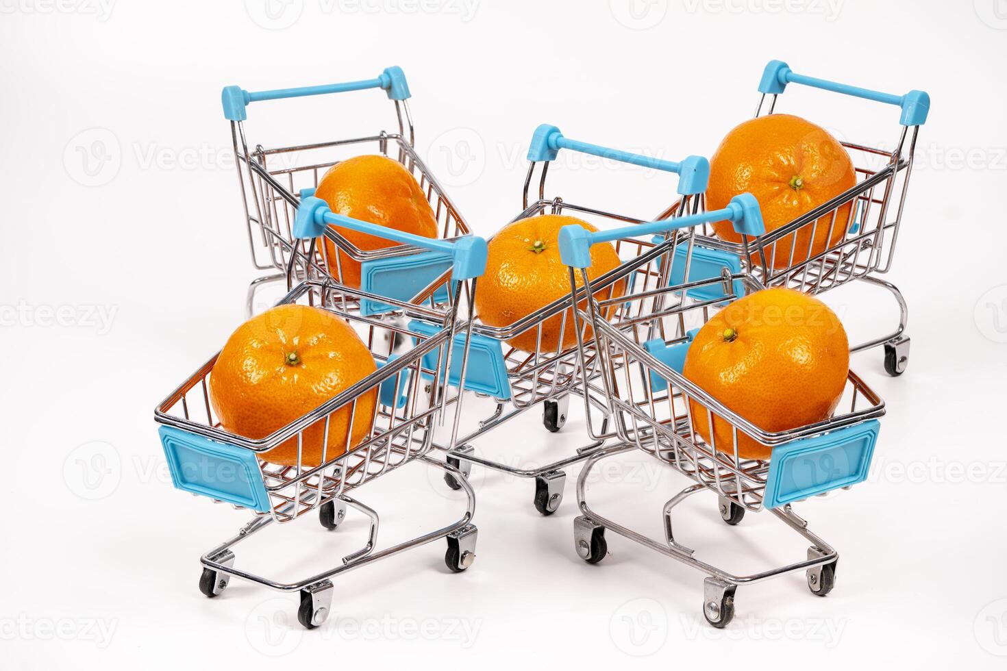 Shopping carts filled with oranges create a colorful display photo