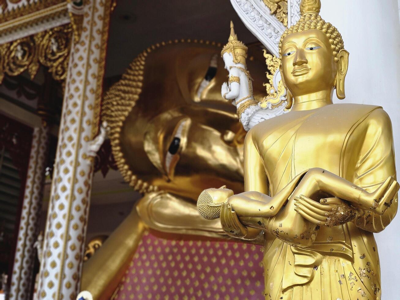 golden Buddha statue has dust on it at Wat Rat Prakong Tham, Nonthaburi Province. photo