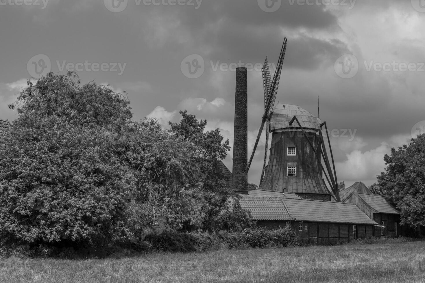 old tractors at a windmill photo