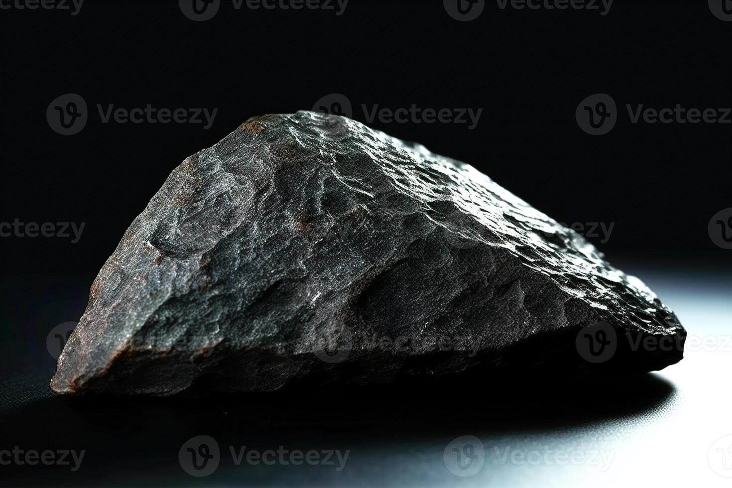 Ottrelite fossil mineral stone. Geological crystalline fossil. Dark background close-up. photo