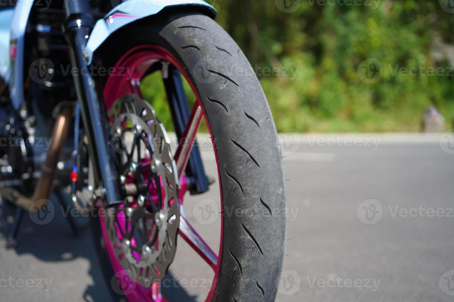 close up of a 4-Stroke underbone category sports motorbike outer tire photo