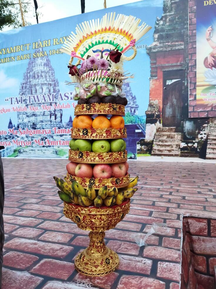 Surakarta, Indonesia, March 18, 2023. Gebogan, pajegan is a form of offering by Hindus in Bali in the form of an arrangement and arrangement of fruit and flowers. photo