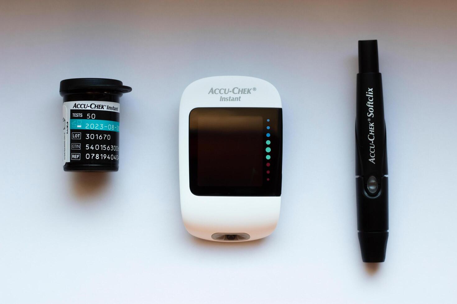 Poznan, Poland - 10.20.2022 Accu-Chek Instant glucose meter with test strips and finger piercing device photo
