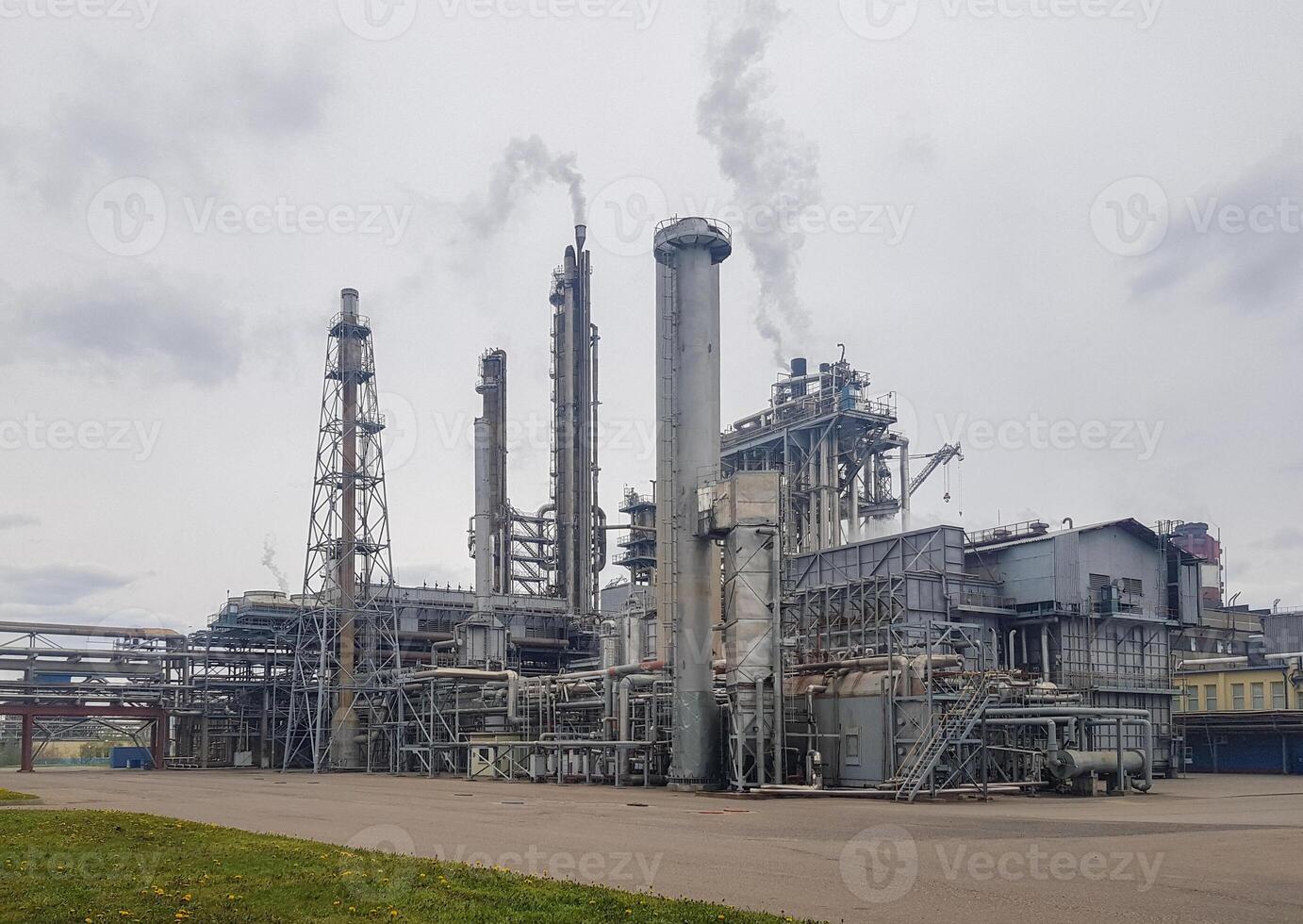 Large-capacity workshop for the production of ammonia of a petrochemical plant. The outer part of the tube furnace, shaft converter, CO2 absorber with copy space. Ammonia workshop under heavy polluted photo