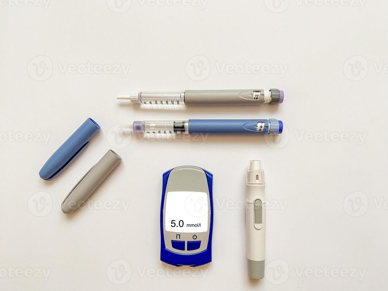 Insulin short, long, glucose meter, test strips and finger piercing pen on a white isolated background. Set for diabetics with mock up photo