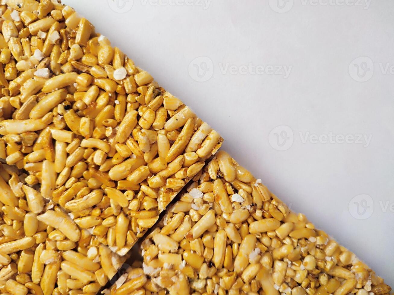 Traditional Indonesian snack called berondong or jipang or popcorn made from rice, corn coated with sweet caramel photo