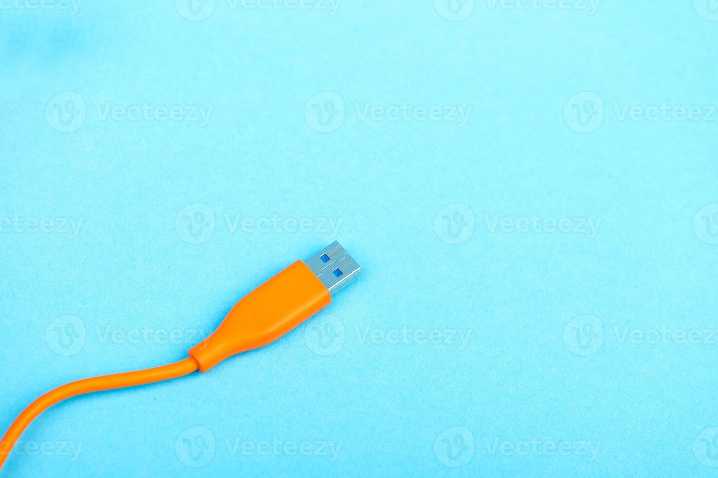 USB Cable Plug isolated on Blue Background photo