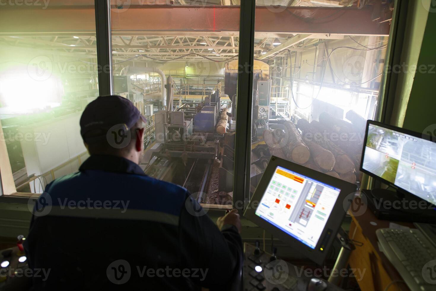 Belarus, the city of Gomil on April 29, 2019. Wood processing plant.Wood processing industry. Wood cutting shop. Worker at the computer controls the cutting of wood photo