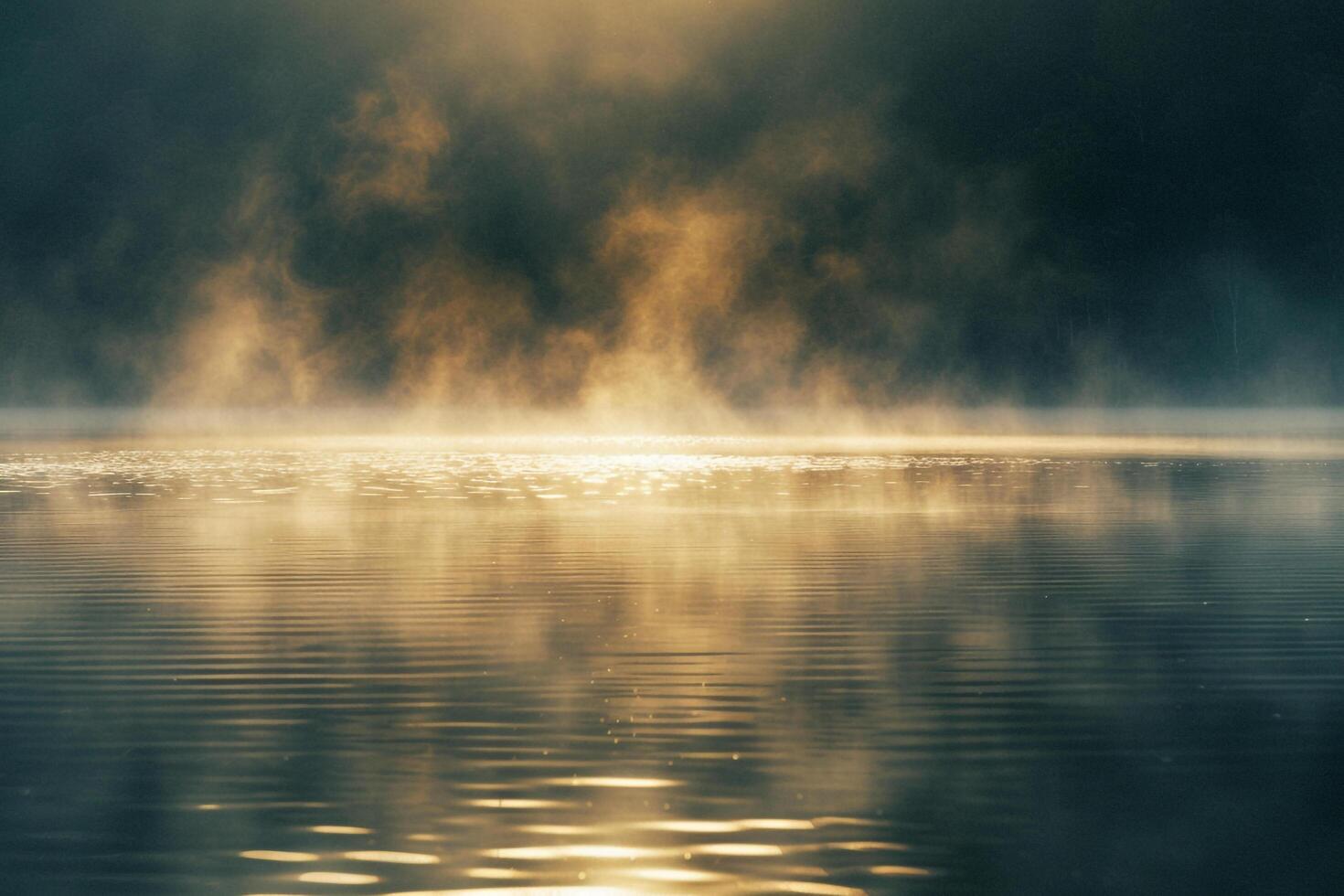 Landscape Sunlight Reflecting Off Serene Lake with Mist Rising from the Water nature background photo