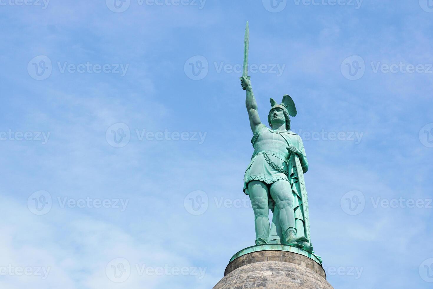 close-up Hermannsdenkmal in Gemany, a memorial for cherusci war chief Arminius or Hermann in German, against blue sky with copy space photo