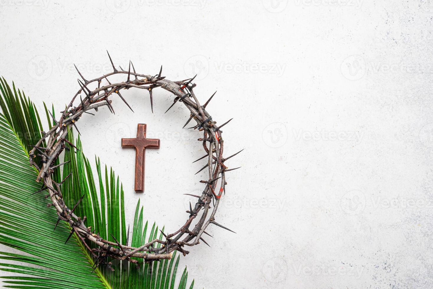 Palm Sunday. Crown of thorns, cristian cross on palm leaf photo