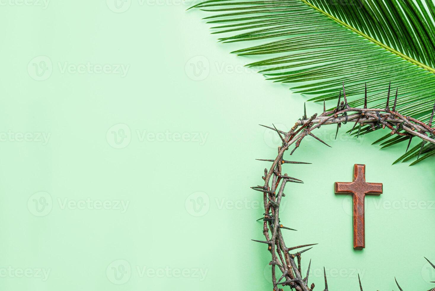 Palm Sunday banner. Thorn crown, wooden cross and palm leaf photo