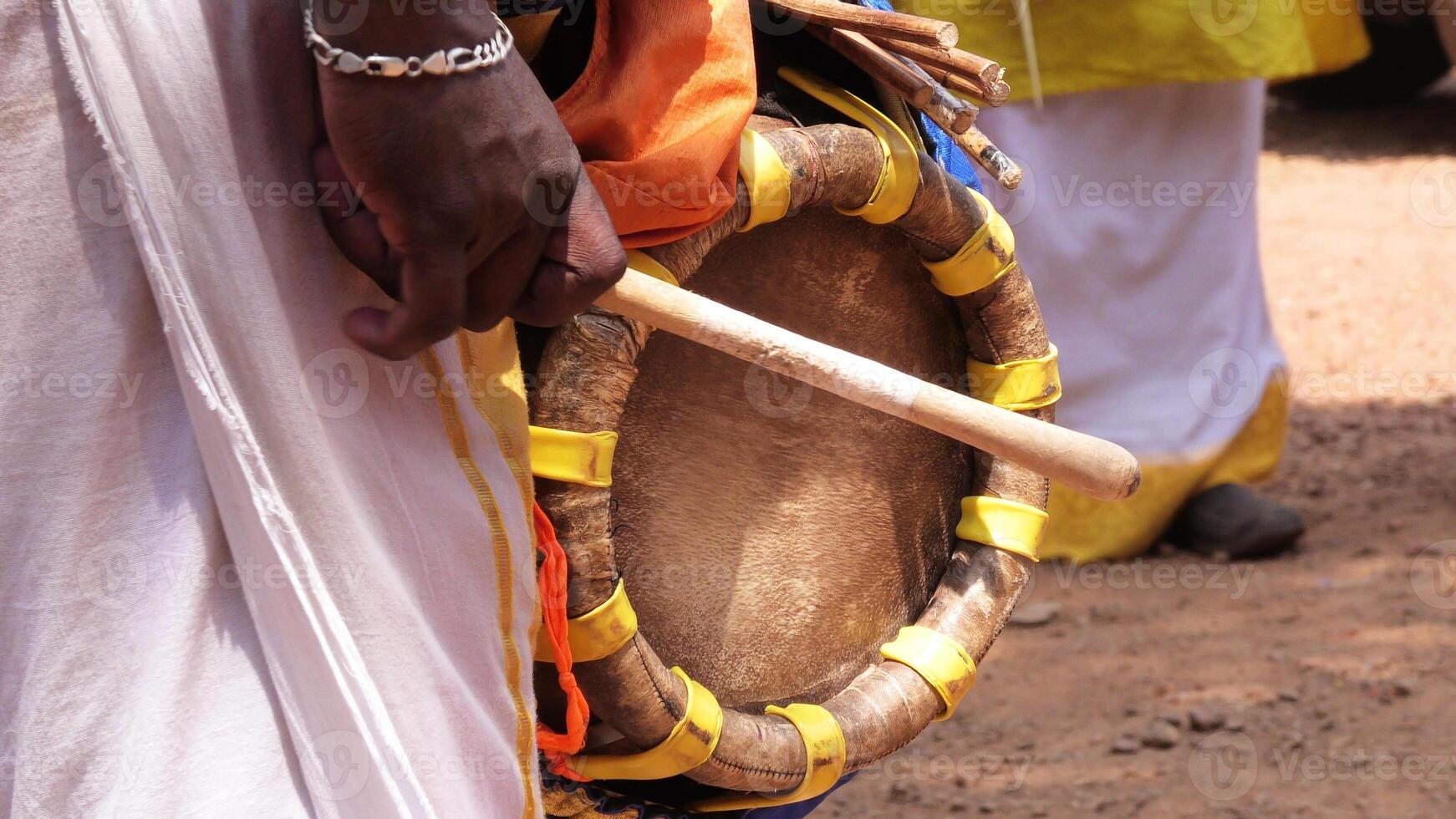 An artist playing Thavil, a South Indian traditional musical instrument photo
