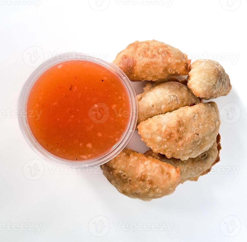 Food called Jalankote, typical of Makassar, South Sulawesi with a white background and delicious chili sauce photo