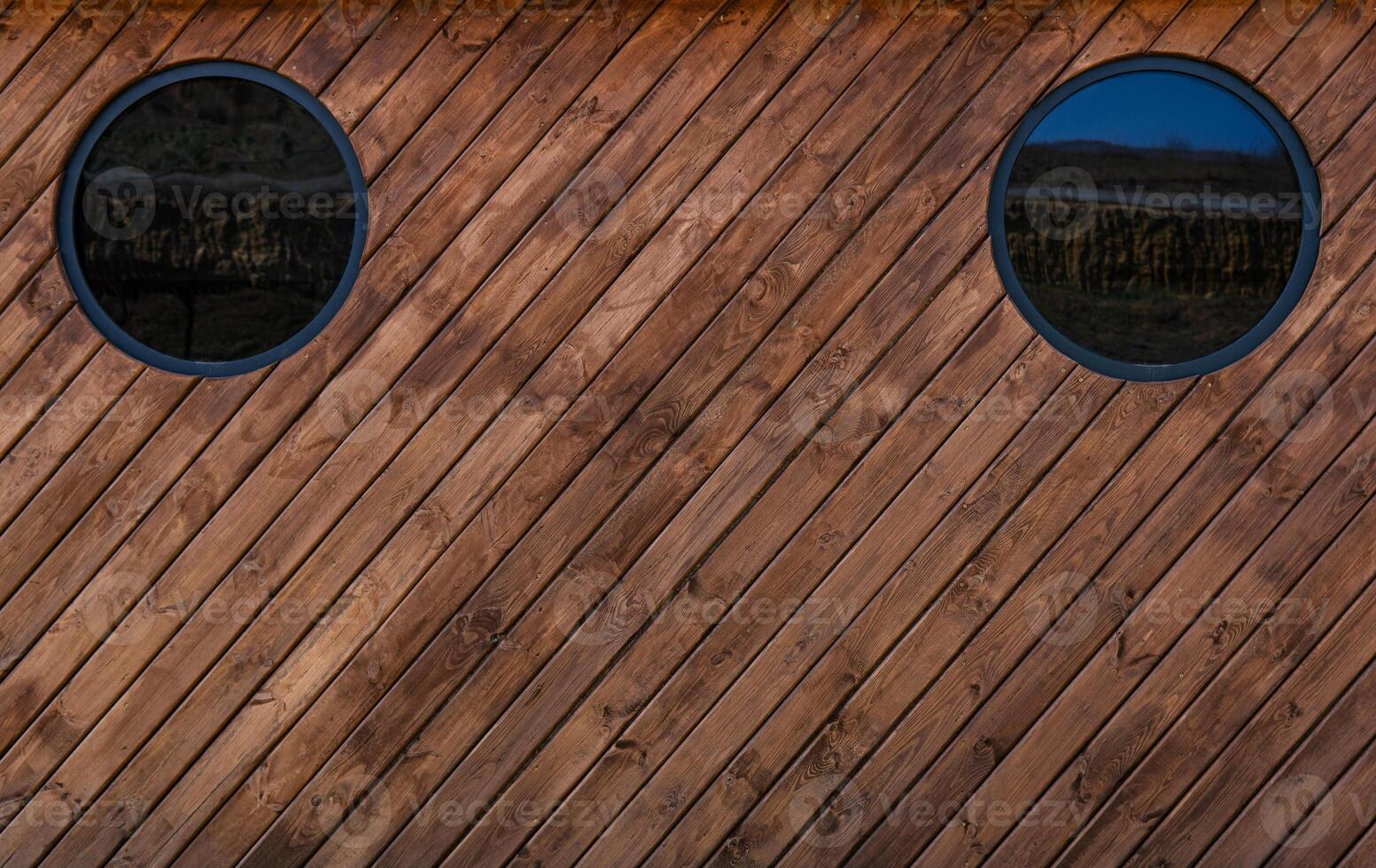 Medium brown wood texture backviewed from above.The wooden planks are stacked diagonally and have a worn look.rn look. photo