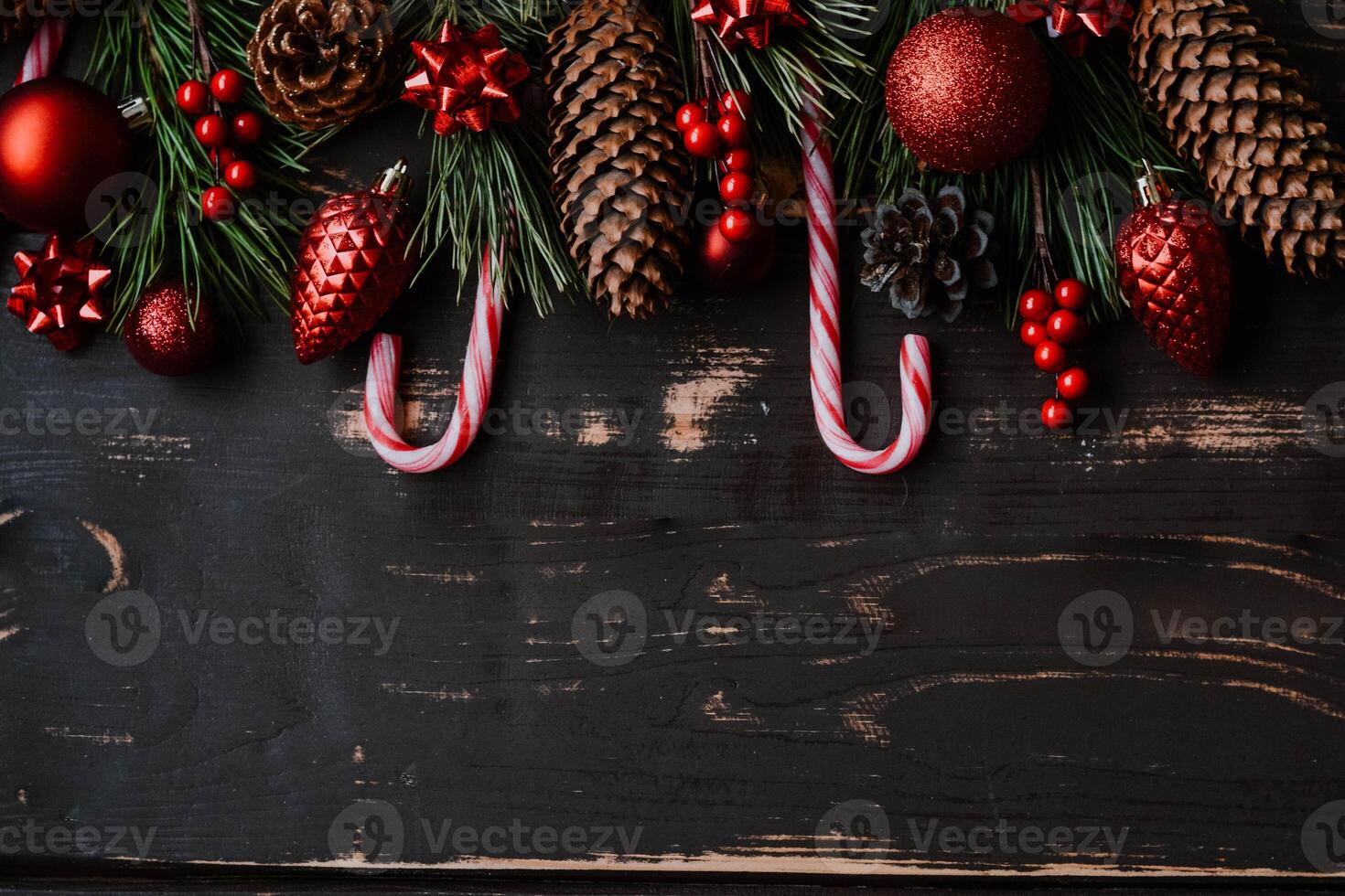 Christmass background red christmas tree toys and spruce brance on wooden background.. Xmas backdrop with space for text.Copyspace. photo