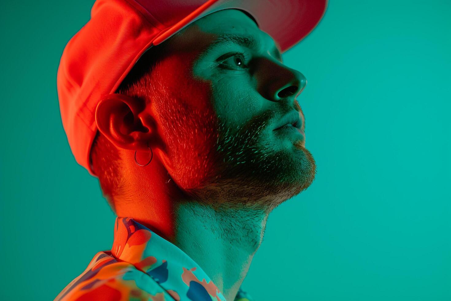 Bold Fashion Male Model in Neon Coral Cap Lifestyle portrait with Neon Green Background photo