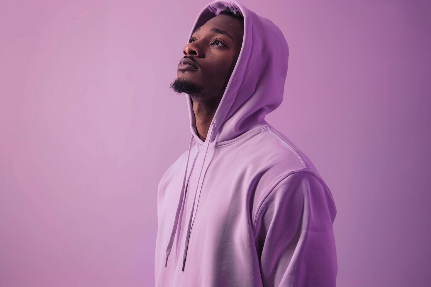 Handsome Fashion Male Model in High end Hoodie with Light Lavender Background Timeless Males portrait Featuring Modern Fashion Apparel photo