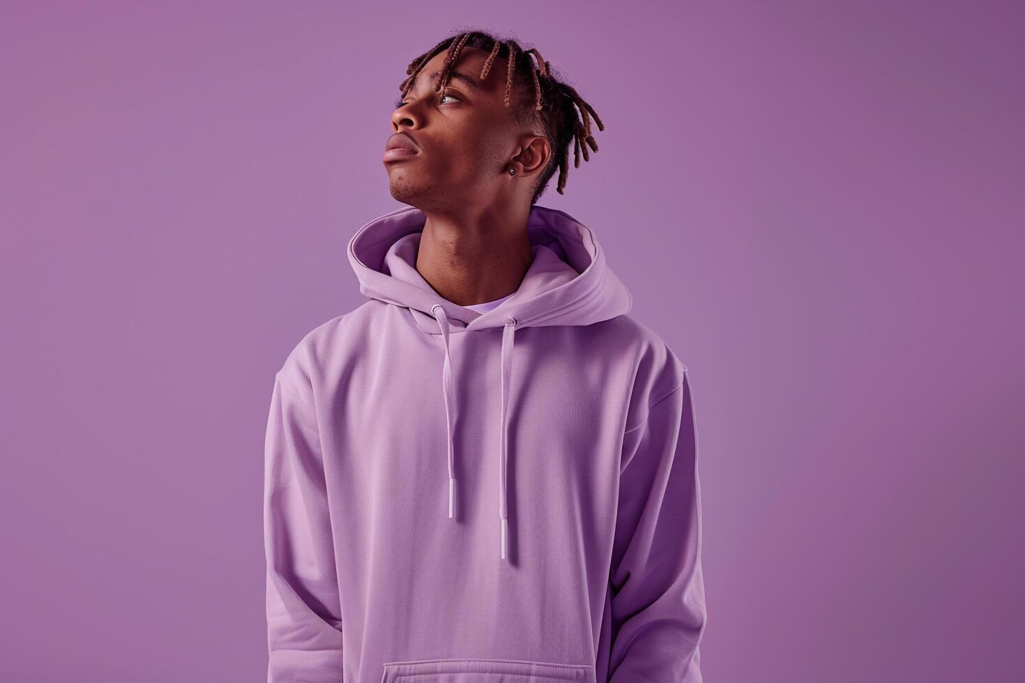 Fashion Model in Hoodie Soft Lilac Background Relaxed portrait Modern and Comfortable Males Casual Style photo