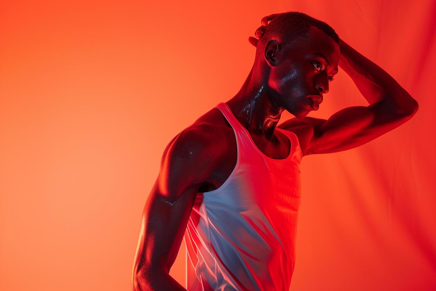 Athletic Shorts and Tank Top Fashion Model in Bright Red Trendy Male portrait with Modern Lifestyle Stylish and Dynamic Look photo