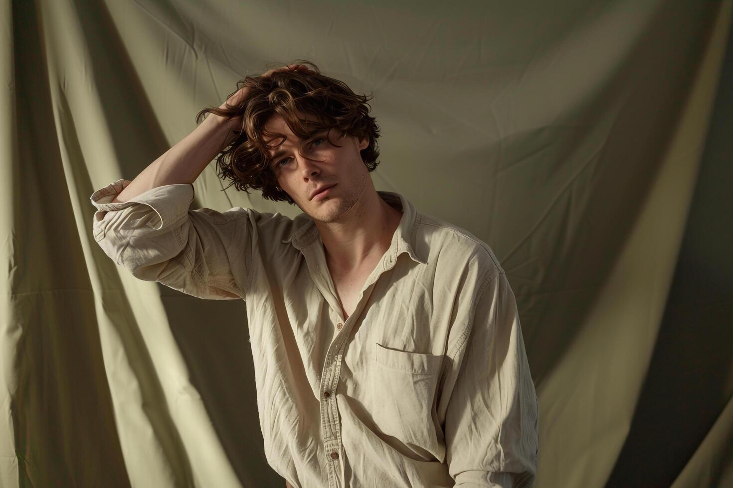 Stylish Males fashion with a casual boho shirt and sage green background showcasing a relaxed and easygoing lifestyle in a modern portrait photo
