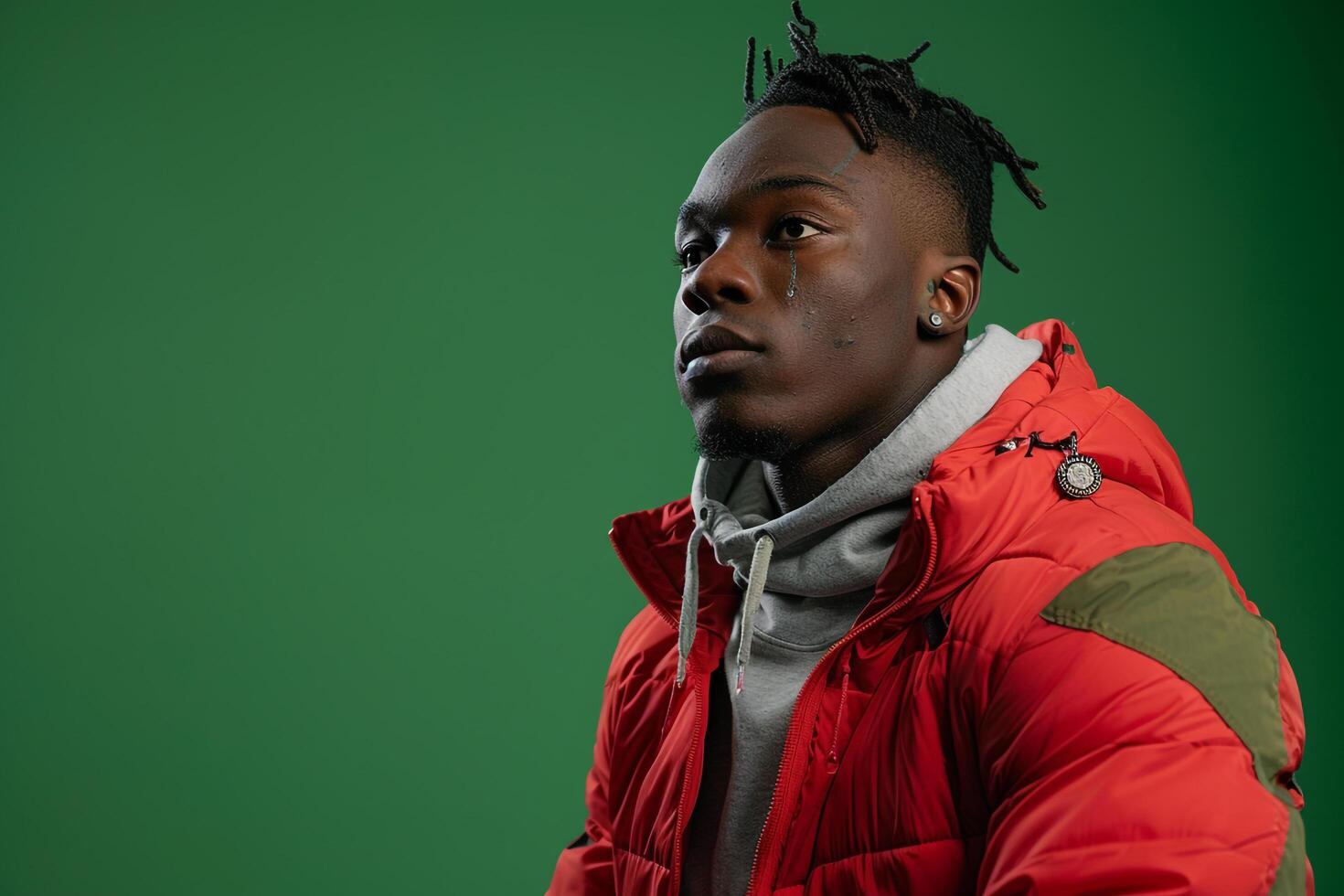 Stylish male model in a trendy jacket with a cucumber green background contemporary portrait highlighting fashionable and chic Males outerwear photo