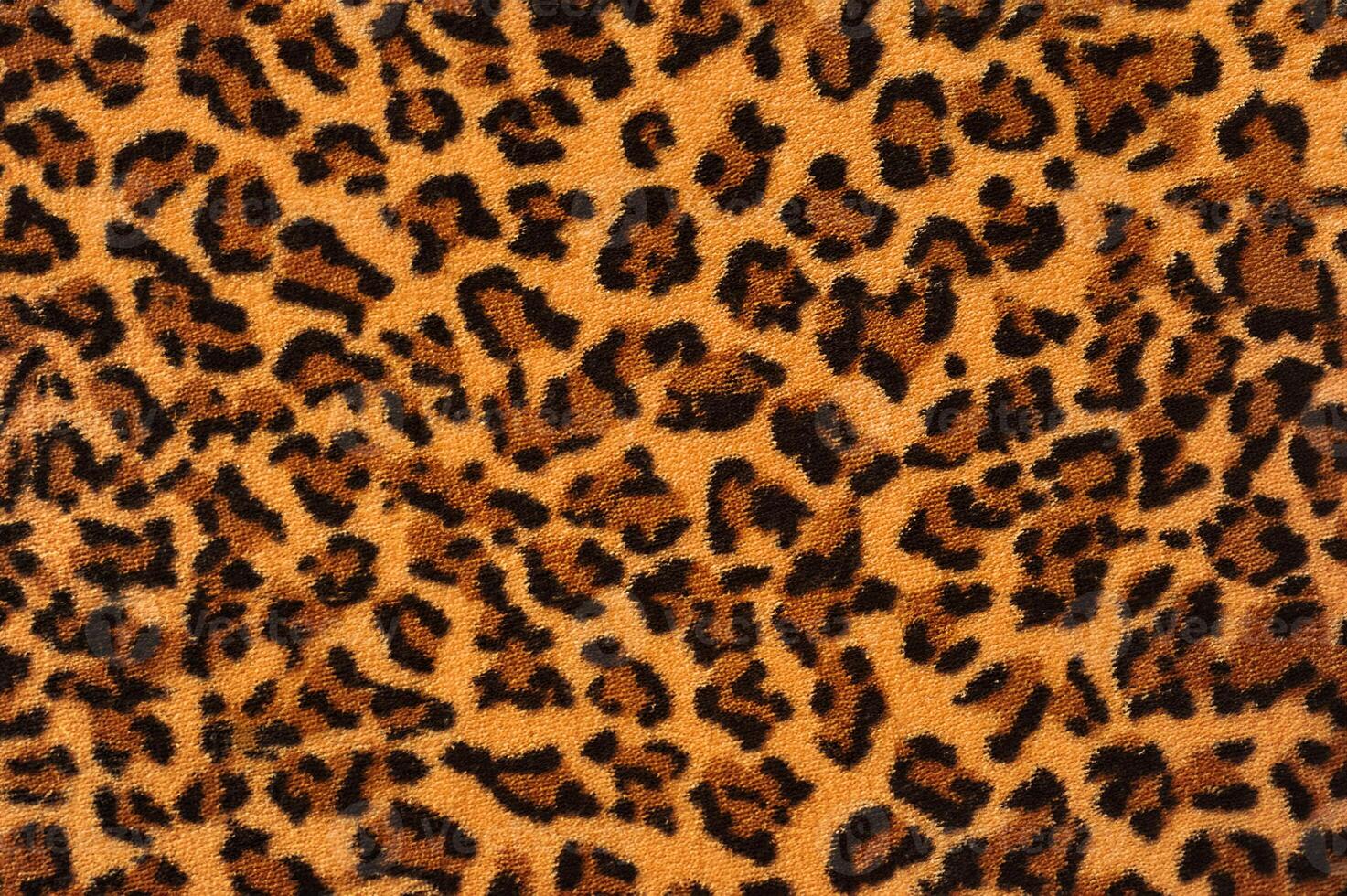 Close-Up of Leopard Print Fabric Texture photo