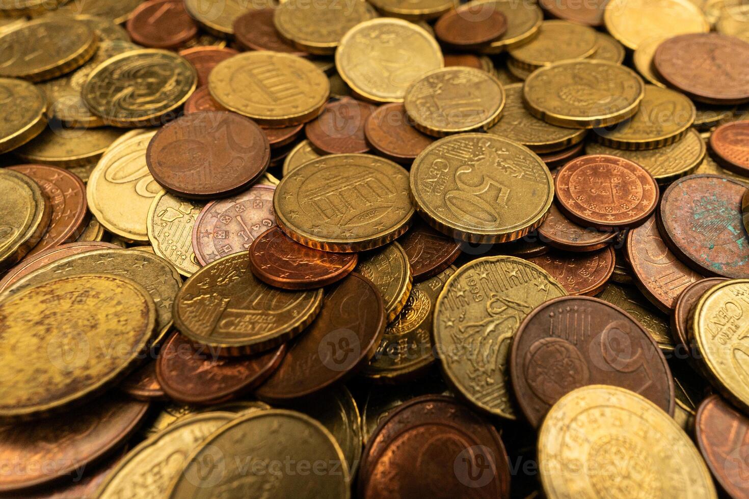 Close-up of a stack of Euro coins, showcasing detailed textures and shining surfaces. Ideal for financial and currency-related content. photo