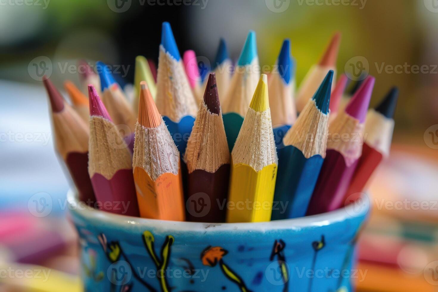 Vibrant Collection of Artist Pencils in a Cup, Ideal for Sketching and Illustration photo