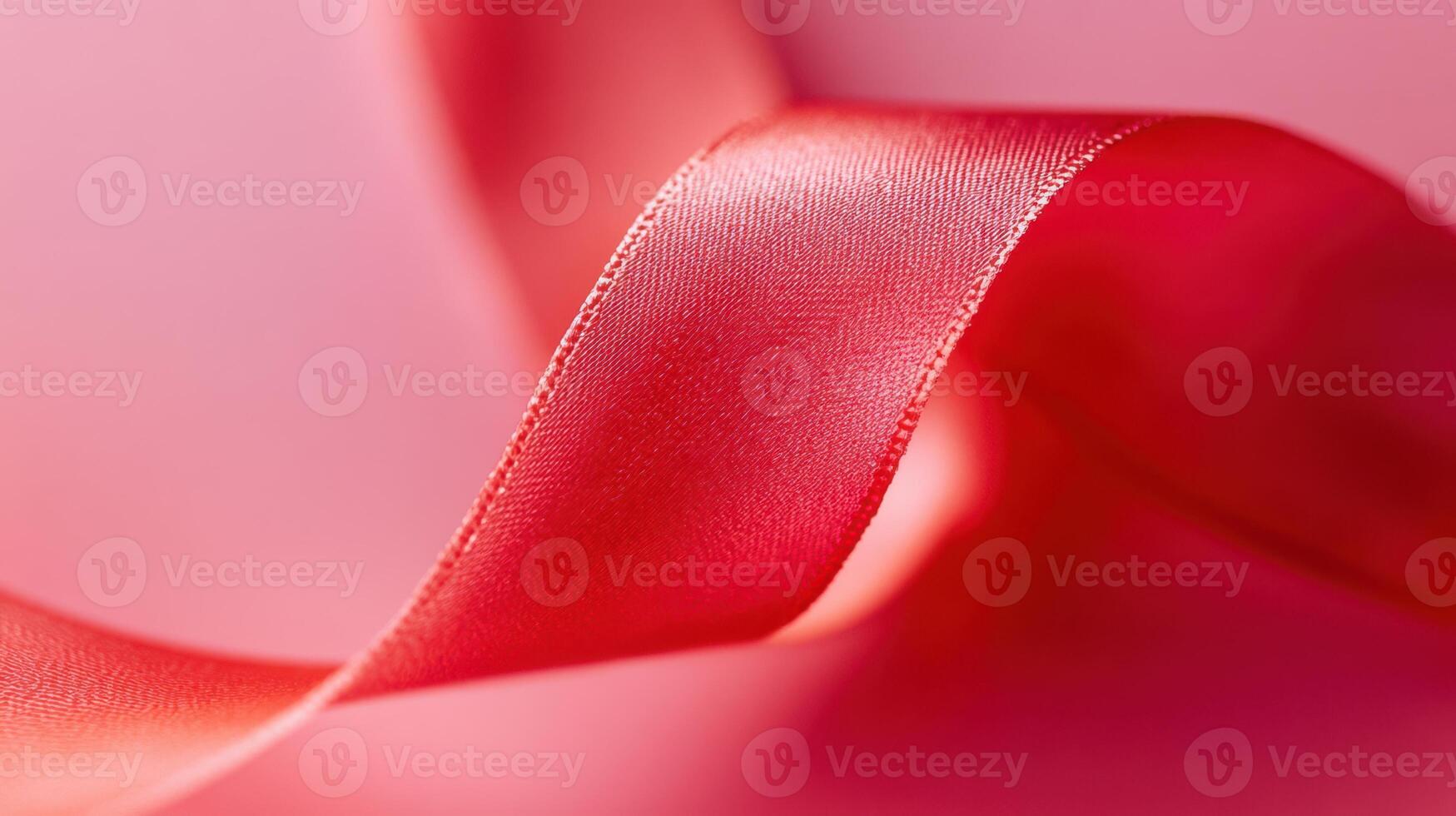 A detailed shot of a bright red ribbon standing out against a differing background photo