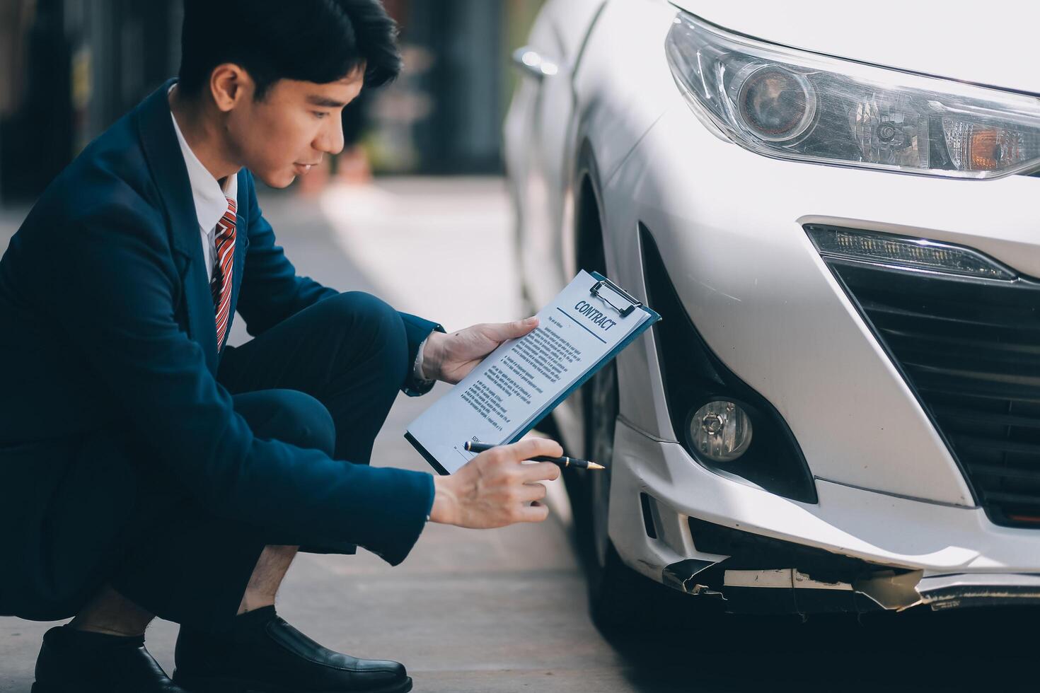A young businesswoman is navigating car insurance options at her desk, considering premiums, deductibles, and coverage while understanding policies and managing claims efficiently. photo