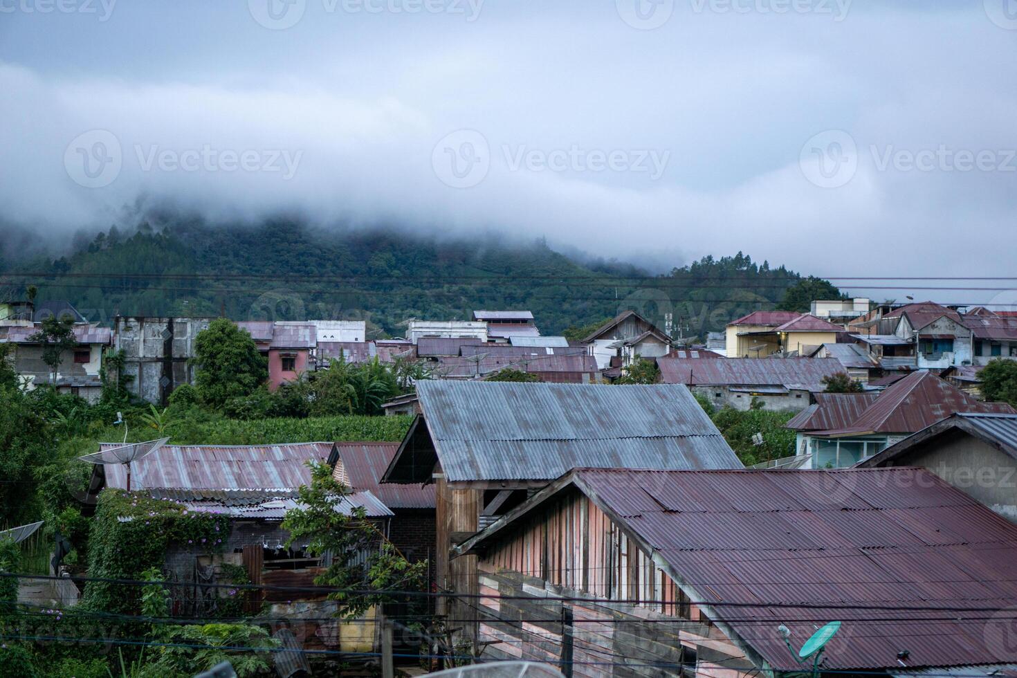 Landscape view of residents houses in Takengon city with mountain in the background. Takengon city at the morning photo