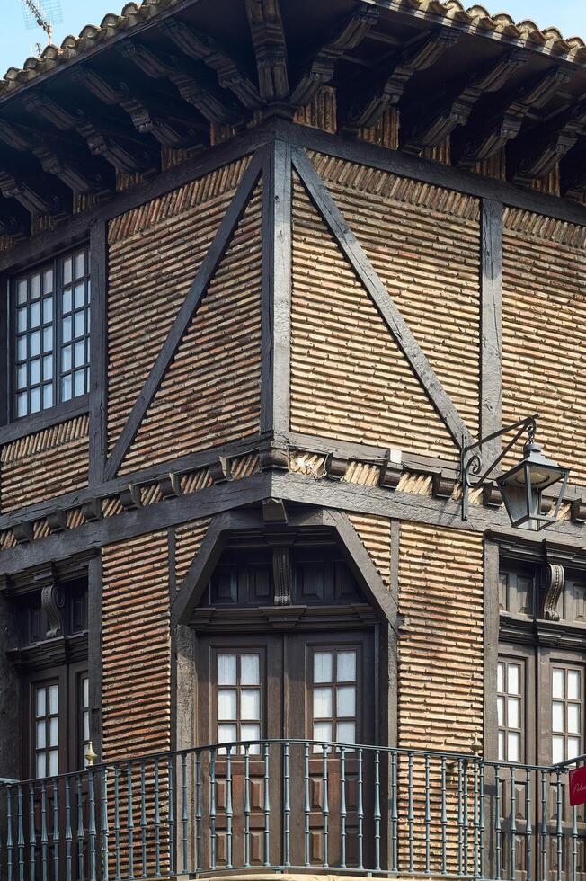 Vitoria Gasteiz, Alava, Spain, 2024, Detail of a typical red brick and wood facade in the city of Vitoria Gasteiz photo
