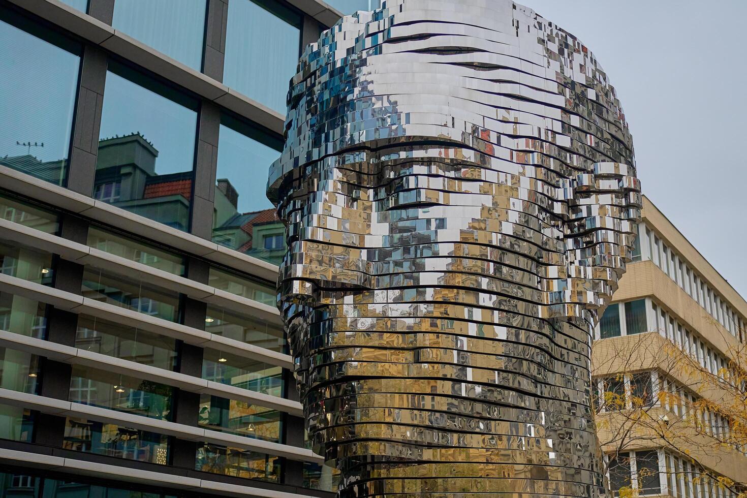 Rotating head of Franc Kafka, art installation in Prague. Metal sculpture made by David Cerny. Contemporary art installation at street. Prague, Czech Republic - October 27, 2024 photo