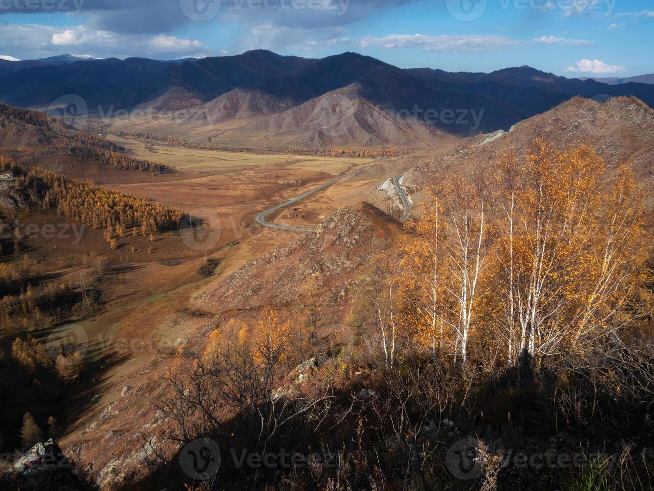 Picturesque autumn mountain valley with a highway loop photo