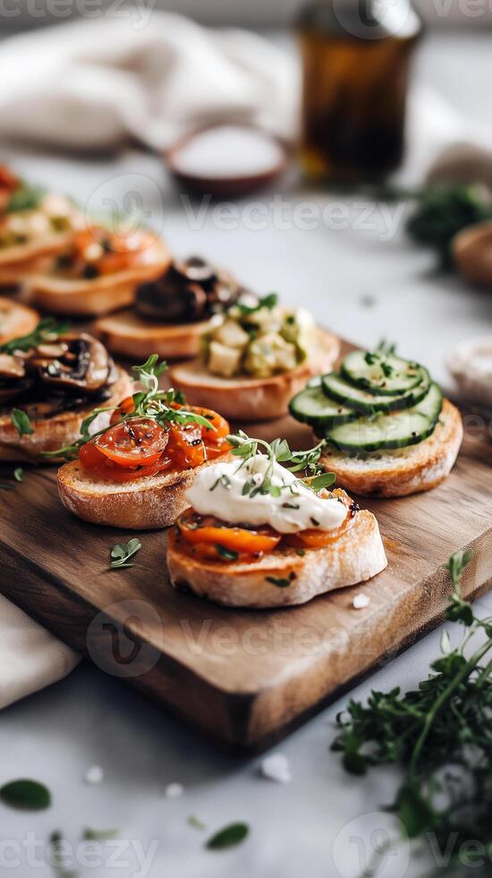 Rustic wooden serving board arranged with an assortment of gourmet mini bruschettas, each topped with vibrant, artfully placed ingredients. photo
