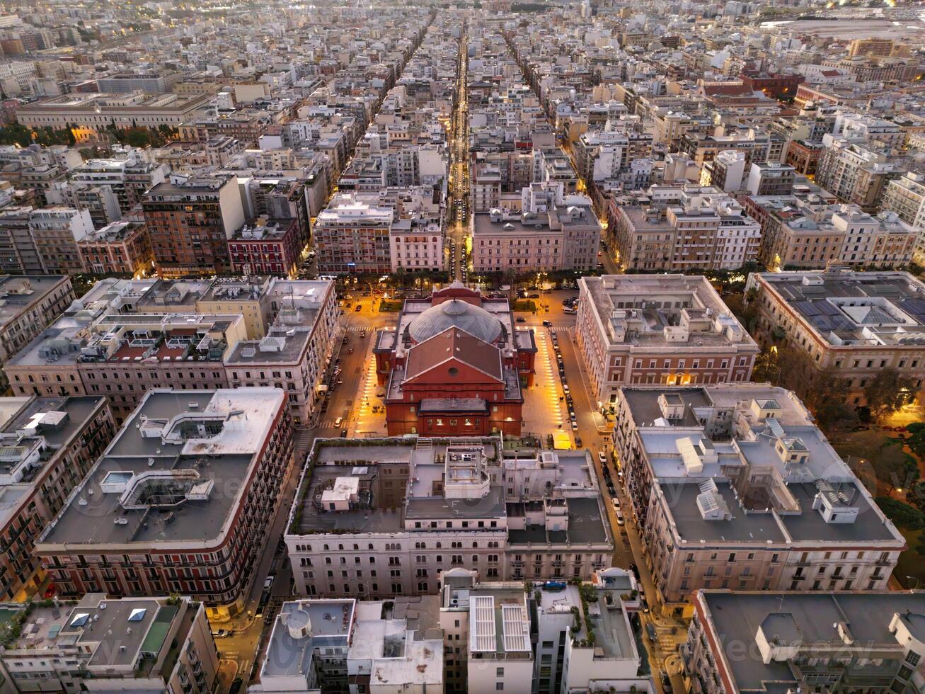 Drone view of city of Bari at night in Italy. lighting of lanterns gives comfort and a sense of calm. A popular place for pilgrims and just tourists. nightlife in Bari is diverse. tourism concept photo