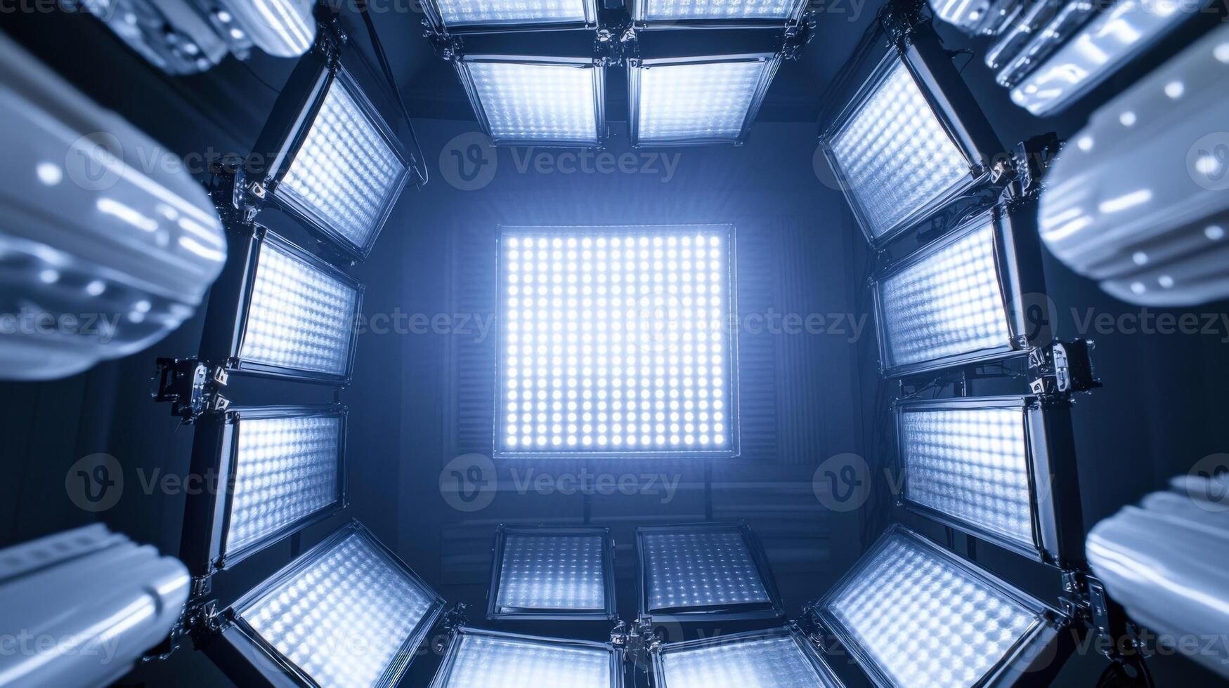 An intricate shot of the softboxs inner lining revealing layers of diffusion material that enhance light quality surrounded by the bright glow of multiple LED panels emitting a sof photo