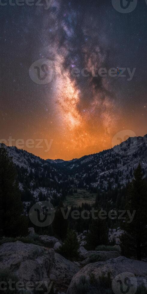The milky way over the mountains in the distance photo
